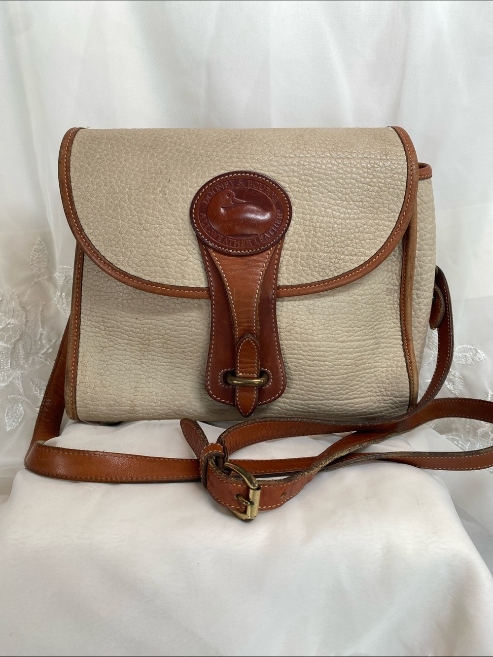 Dooney & Bourke Essex Cream Pebbled Leather Crossbody with Brown Trim